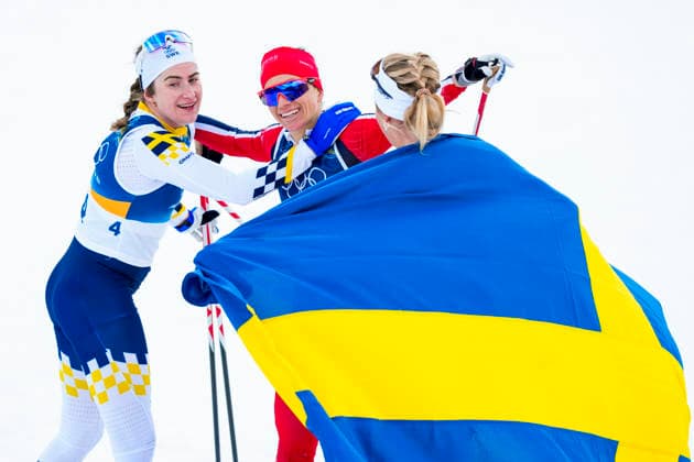 Winter Olympics in Milan Cortina 2026 Val di Fiemme, Italy 20260207. Ebba Andersson from Sweden, Heidi Weng from Norway and Frida Karlsson from Sweden cheer during the women s cross-country 20 km Skiathlon at Lago di Tesero during the Milan Cortina 2026 Winter Olympics. Photo: Lise Aserud NTB Val di Fiemme Italy EDITORIAL USE ONLY. RESTRICTED USE FOR BETTING COMPANIES Ref:_SPOIvydbvgRT10.jpg *** Winter Olympics in Milan Cortina 2026 Val di Fiemme, Italy 20260207 Ebba Andersson from Sweden, Heidi Weng from Norway and Frida Karlsson from Sweden cheer during the women s cross country 20 km Skiathlon at Lago di Tesero during the Milan Cortina 2026 Winter Olympics Photo Lise Aserud NTB Val di Fiemme Italy EDITORIAL USE ONLY RESTRICTED USE FOR BETTING COMPANIES  Copyright: xLisexAserudx xNTBx
