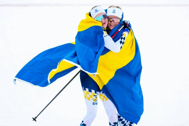 Winter Olympics in Milan Cortina 2026 Val di Fiemme, Italy 20260207. Ebba Andersson from Sweden and Frida Karlsson from Sweden cheer during the women s cross-country 20 km Skiathlon at Lago di Tesero during the Milan Cortina 2026 Winter Olympics. Photo: Lise Aserud NTB Val di Fiemme Italy EDITORIAL USE ONLY. RESTRICTED USE FOR BETTING COMPANIES Ref:_SPOMzmQ_dFfIeQ.jpg *** Winter Olympics in Milan Cortina 2026 Val di Fiemme, Italy 20260207 Ebba Andersson from Sweden and Frida Karlsson from Sweden cheer during the women s cross country 20 km Skiathlon at Lago di Tesero during the Milan Cortina 2026 Winter Olympics Photo Lise Aserud NTB Val di Fiemme Italy EDITORIAL USE ONLY RESTRICTED USE FOR BETTING COMPANIES  Copyright: xLisexAserudx xNTBx