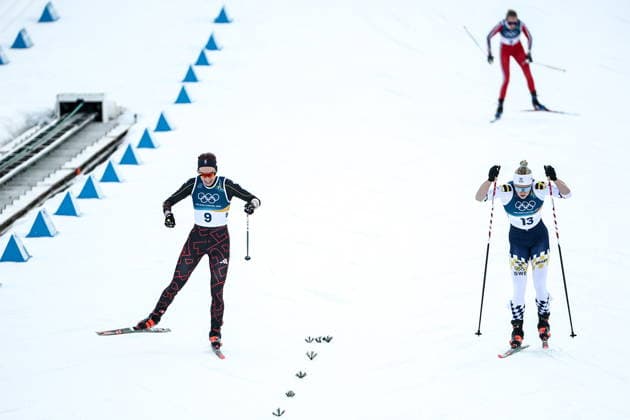 ITALY, TRENTINO-SOUTH TYROL - FEBRUARY 7, 2026: Pia Fink of Germany, and Jonna Sundling (L-R front) of Sweden compete in a women s 10km + 10km skiathlon race during the 2026 Winter Olympic Games, Olympische Spiele, Olympia, OS at the Tesero Cross-Country Skiing Stadium. Mikhail Tereshchenko TASS  88327370