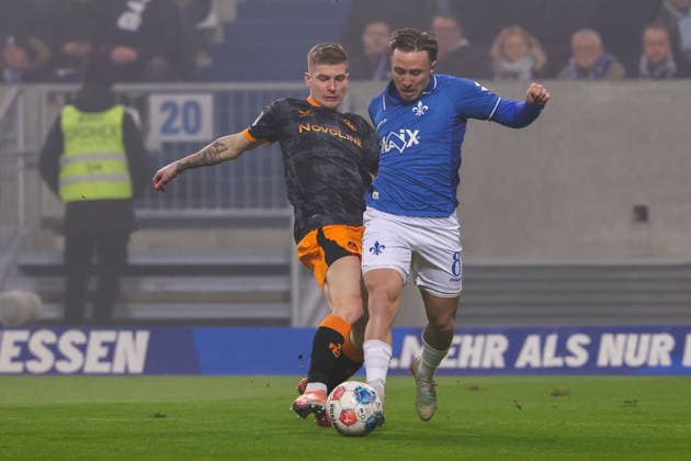 FBL Germany 2 Bundesliga SV Darmstadt 98 1 FC Kaiserslautern Paul Joly 1 FC Kaiserslautern , Luca Marseiler SV Darmstadt 98 , battles for the Ball during the 2 Bundesliga 2025 26 match between SV Darmstadt 98 and 1 FC Kaiserslautern at Merckstadion am Böllenfalltor on 7 February 2026 in Darmstadt, Germany DFL DFB REGULATIONS PROHIBIT ANY USE OF PHOTOGRAPHS as IMAGE SEQUENCES and or QUASI VIDEO Copyright: JoaquimxFerreira