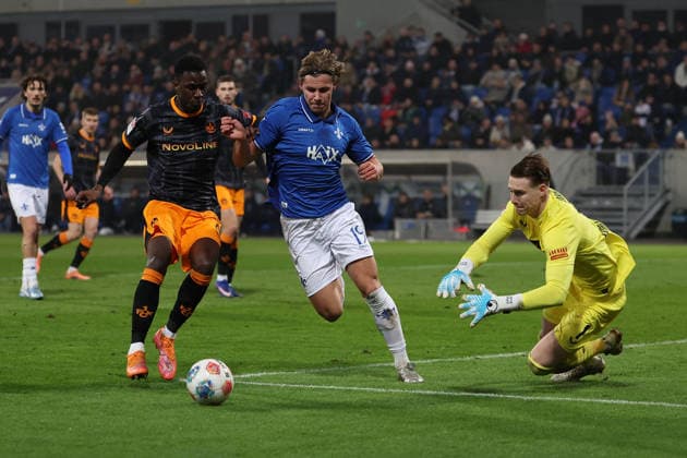 FBL Germany 2 Bundesliga SV Darmstadt 98 1 FC Kaiserslautern Maxwell Gyamfi 1 FC Kaiserslautern , Fynn Luca Lakenmacher SV Darmstadt 98 , Goalkeeper Julian Krahl 1 FC Kaiserslautern battles for the Ball during the 2 Bundesliga 2025 26 match between SV Darmstadt 98 and 1 FC Kaiserslautern at Merckstadion am Böllenfalltor on 7 February 2026 in Darmstadt, Germany DFL DFB REGULATIONS PROHIBIT ANY USE OF PHOTOGRAPHS as IMAGE SEQUENCES and or QUASI VIDEO Copyright: JoaquimxFerreira