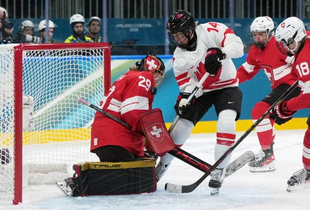 February 7, 2026, Milan, ITALY: Switzerland goalie Saskia Maurer (29) makes the save on CanadaöÄÃ s Renata Fast (14) during the first period of a preliminary round women s hockey game at the Milan Cortina Winter Olympics, in Milan, on Saturday, Feb. 7, 2026. Canada News - February 7, 2026  - ZUMAc35_ 20260207_zaf_c35_087 Copyright: xDarrylxDyckx