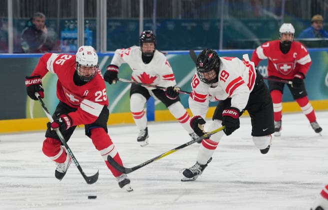 (260208) -- MILAN, Feb. 8, 2026 -- Alina Muller (1st L) of Switzerland vies with Brianne Jenner of Canada during the Ice hockey, Eishockey women s preliminary round group A match between Switzerland and Canada at the Milan-Cortina 2026 Olympic Winter games, Winterspiele,Spiele, Summer games in Milan, Italy, Feb. 7, 2026. ) (MICO2026)ITALY-MILAN-OLYMPIC WINTER GAMES-ICE HOCKEY-WOMEN-PRELIMINARY ROUND-SUI VS CAN TaoxXiyi 