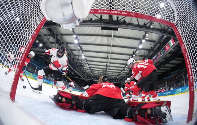 (260208) -- MILAN, Feb. 8, 2026 -- Goalkeeper Saskia Maurer (C) of Switzerland defends during the Ice hockey, Eishockey women s preliminary round group A match between Switzerland and Canada at the Milan-Cortina 2026 Olympic Winter games, Winterspiele,Spiele, Summer games in Milan, Italy, Feb. 7, 2026. ( Pool via Xinhua) (MICO2026)ITALY-MILAN-OLYMPIC WINTER GAMES-ICE HOCKEY-WOMEN-PRELIMINARY ROUND-SUI VS CAN TaoxXiyi 