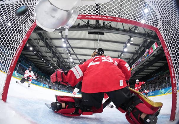(260208) -- MILAN, Feb. 8, 2026 -- Goalkeeper Saskia Maurer of Switzerland fails to save a goal during the Ice hockey, Eishockey women s preliminary round group A match between Switzerland and Canada at the Milan-Cortina 2026 Olympic Winter games, Winterspiele,Spiele, Summer games in Milan, Italy, Feb. 7, 2026. ( Pool via Xinhua) (MICO2026)ITALY-MILAN-OLYMPIC WINTER GAMES-ICE HOCKEY-WOMEN-PRELIMINARY ROUND-SUI VS CAN TaoxXiyi 