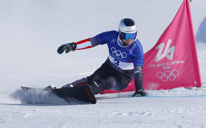 Milan Cortina Olympics: Snowboarding Benjamin Karl of Austria competes en route to winning the snowboarding men s parallel giant slalom gold at the Milan Cortina Olympics at Livigno Snow Park in Livigno, Italy, on Feb. 8, 2026.  A14AA0005256764P