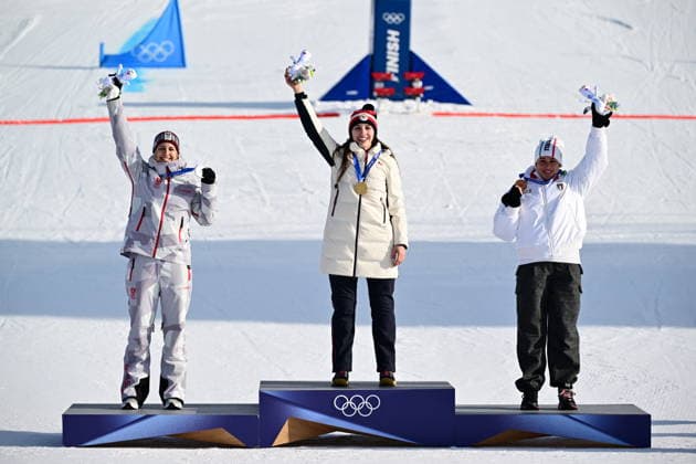 XXV Winter Olympic Games, Olympische Spiele, Olympia, OS Snowboarding - Women s Parallel Giant Slalom,Finals, February 8, 2026, Livigno. L-R The second placed Sabine Payer from Austrie, winner Zuzana Maderova from Czechia and Lucia Dalmass from Italy pose with their medals and olympic mascot stoat Tina. (CTKxPhoto DavidxTanecek) CTKPhotoP2026020804644  CTKPhotoP2026020804644