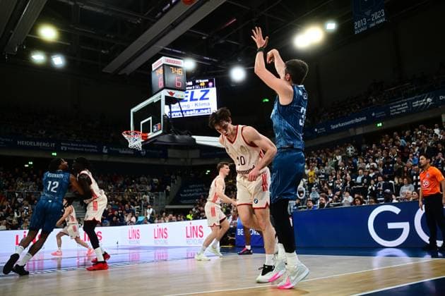 Game action with Justus Hollatz 21 FC Bayern Basketball in white jersey throwing easyCredit BBL MLP Academics Heidelberg - FC Bayern München Basketball 08 02 2026 Copyright: xMichaelxGelhardtx