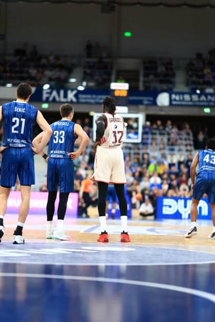 Scene with Wenyen Gabriel 32 FC Bayern Basketball and Mateo Seric 21 MLP Academics Heidelberg and Ryan Mikesell 33 MLP Academics Heidelberg on the pitch easyCredit BBL MLP Academics Heidelberg - FC Bayern Munich Basketball 08 02 2026 Copyright: xMichaelxGelhardtx