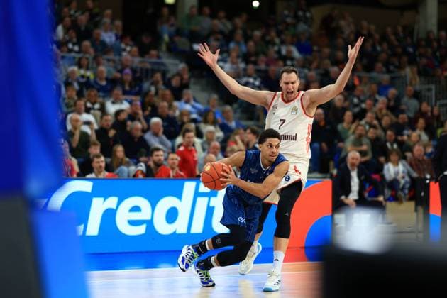 Scene with Johannes Voigtmann 7 FC Bayern Basketball and Kevin McClain 3 MLP Academics Heidelberg in action on the pitch easyCredit BBL MLP Academics Heidelberg - FC Bayern Munich Basketball 08 02 2026 Copyright: xMichaelxGelhardtx