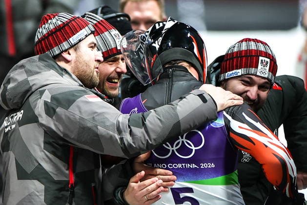 ITALY - FEBRUARY 8, 2026: Jonas Mueller (R in the centre) of Austria celebrates winning silver in Run 4 of the men s singles luge event at Cortina Sliding Centre in Cortina dâ€™Ampezzo during the 2026 Winter Olympic Games, Olympische Spiele, Olympia, OS Peter Kovalev TASS  88399608