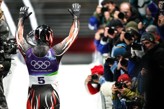 ITALY - FEBRUARY 8, 2026: Jonas Mueller of Austria celebrates winning silver in Run 4 of the men s singles luge event at Cortina Sliding Centre in Cortina dâ€™Ampezzo during the 2026 Winter Olympic Games, Olympische Spiele, Olympia, OS Peter Kovalev TASS  88399610