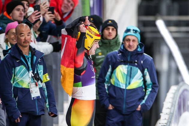 ITALY, CORTINA Dâ€™AMPEZZO - FEBRUARY 8, 2026: Max Langenhan (C) of Germany celebrates winning gold in the men s singles luge event at Cortina Sliding Centre during the 2026 Winter Olympic Games, Olympische Spiele, Olympia, OS Peter Kovalev TASS  88400053