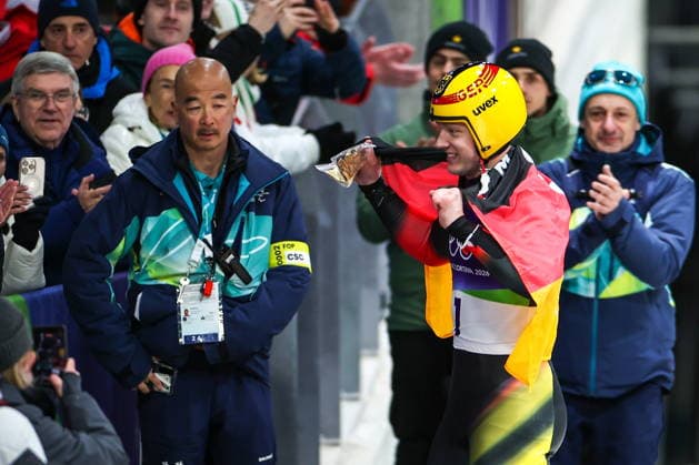 ITALY, CORTINA Dâ€™AMPEZZO - FEBRUARY 8, 2026: Max Langenhan (R front) of Germany celebrates winning gold in the men s singles luge event at Cortina Sliding Centre during the 2026 Winter Olympic Games, Olympische Spiele, Olympia, OS Peter Kovalev TASS  88400805