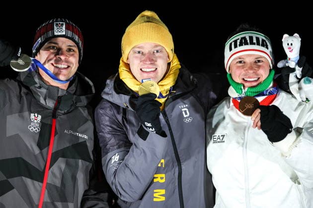 ITALY, CORTINA Dâ€™AMPEZZO - FEBRUARY 8, 2026: Silver medalist Jonas Mueller of Austria, gold medalist Max Langenhan of Germany, and bronze medalist Dominik Fischnaller (L-R) of Italy pose at an award ceremony for the men s singles luge event at Cortina Sliding Centre during the 2026 Winter Olympic Games, Olympische Spiele, Olympia, OS Peter Kovalev TASS  88400441