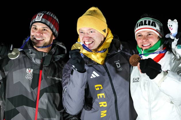 ITALY, CORTINA Dâ€™AMPEZZO - FEBRUARY 8, 2026: Silver medalist Jonas Mueller of Austria, gold medalist Max Langenhan of Germany, and bronze medalist Dominik Fischnaller (L-R) of Italy pose at an award ceremony for the men s singles luge event at Cortina Sliding Centre during the 2026 Winter Olympic Games, Olympische Spiele, Olympia, OS Peter Kovalev TASS  88400443