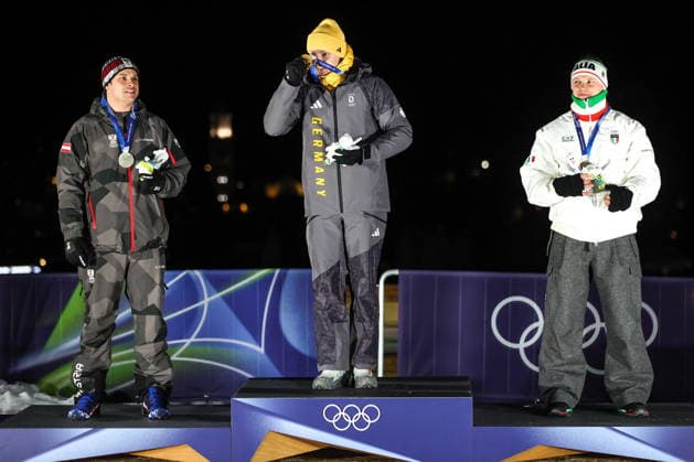 ITALY, CORTINA Dâ€™AMPEZZO - FEBRUARY 8, 2026: Silver medalist Jonas Mueller of Austria, gold medalist Max Langenhan of Germany, and bronze medalist Dominik Fischnaller (L-R) of Italy pose at an award ceremony for the men s singles luge event at Cortina Sliding Centre during the 2026 Winter Olympic Games, Olympische Spiele, Olympia, OS Peter Kovalev TASS  88400645