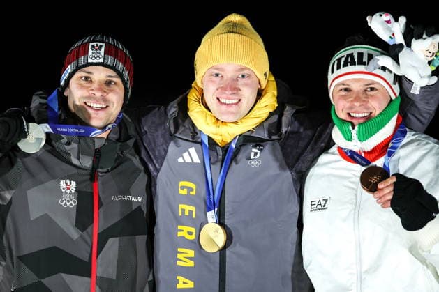 ITALY, CORTINA Dâ€™AMPEZZO - FEBRUARY 8, 2026: Silver medalist Jonas Mueller of Austria, gold medalist Max Langenhan of Germany, and bronze medalist Dominik Fischnaller (L-R) of Italy pose at an award ceremony for the men s singles luge event at Cortina Sliding Centre during the 2026 Winter Olympic Games, Olympische Spiele, Olympia, OS Peter Kovalev TASS  88400753