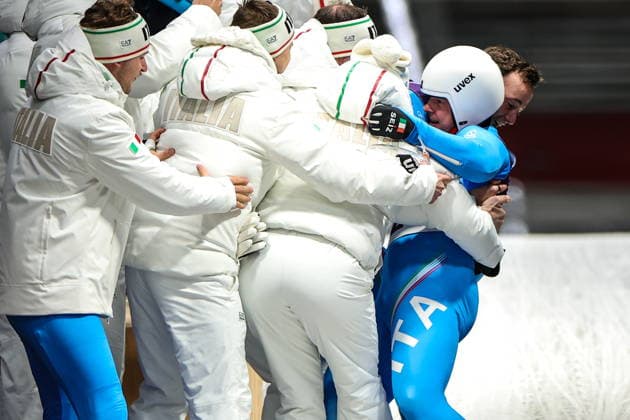 ITALY, CORTINA Dâ€™AMPEZZO - FEBRUARY 8, 2026: Dominik Fischnaller (R) of Italy celebrates winning bronze in the men s singles luge event at Cortina Sliding Centre during the 2026 Winter Olympic Games, Olympische Spiele, Olympia, OS Peter Kovalev TASS  88400960