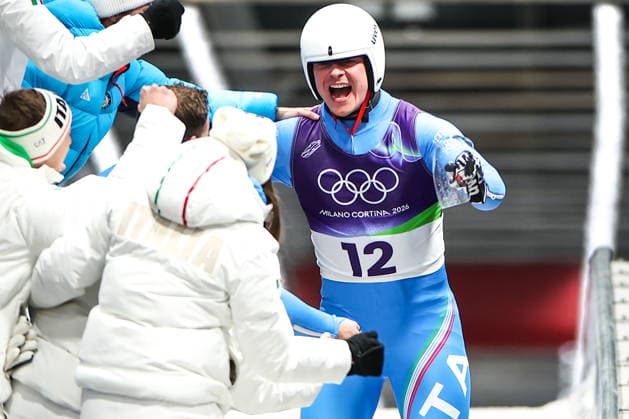 ITALY, CORTINA Dâ€™AMPEZZO - FEBRUARY 8, 2026: Dominik Fischnaller (R) of Italy celebrates winning bronze in the men s singles luge event at Cortina Sliding Centre during the 2026 Winter Olympic Games, Olympische Spiele, Olympia, OS Peter Kovalev TASS  88401074