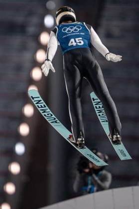 OLYMPICS - Winter Olympic Games, Olympische Spiele, Olympia, OS Milano Cortina 2026 VAL DI FIEMME,ITALY,08.FEB.26 - OLYMPICS, Ski jumping, Skispringen, Ski, nordisch - Winter Olympic Games Milano Cortina 2026, normal hill, men, training. Image shows Philipp Raimund (GER) and a drone.  GEPAxpictures xOliverxLerch
