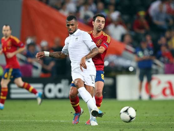 Spain V France, UEFA EURO, EM, Europameisterschaft,Fussball 2012 Quarter Final Xavi Hernandez of Spain and Yann M Vila of France challenge during the UEFA Euro 2012 Quarter Final match between Spain and France at Donbass Arena on June 23, 2012 in Donetsk, Ukraine. Donetsk Donbass Arena Ukraine Ukraine Copyright: xAllstarxPicturexLibraryxLtdx