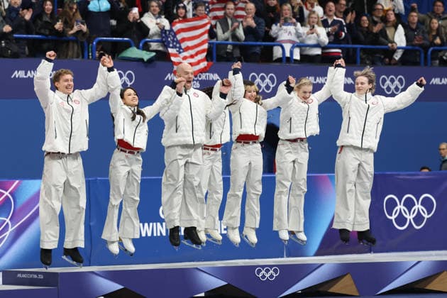 February 8, 2026, Milan, Lombardy, Italy: EVAN BATES, MADISON CHOCK, DANNY O SHEA, ELLIE KAM, ALYSA LIU, AMBER GLENN and ILIA MALININ of Team USA jump to celebrate winning the gold medal during the Victory Ceremony of the Figure skating, Eiskunstlauf Team Event at the Milano Cortina 2026 Winter Olympic Games, Olympische Spiele, Olympia, OS Olympics 2026: Milano Cortina: Figure Skating Team Event  - ZUMAc179 20260208_oly_c179_095 Copyright: xMickaelxChavetx