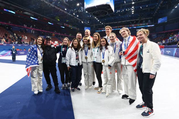 February 8, 2026, Milan, Lombardy, Italy: USA STAFF and athletes EVAN BATES, MADISON CHOCK, DANNY O SHEA, ELLIE KAM, ALYSA LIU, AMBER GLENN and ILIA MALININ of Team USA jump to celebrate winning the gold medal during the Victory Ceremony of the Figure skating, Eiskunstlauf Team Event at the Milano Cortina 2026 Winter Olympic Games, Olympische Spiele, Olympia, OS Milan Italy - ZUMAc179 20260208_oly_c179_080 Copyright: xMickaelxChavetx
