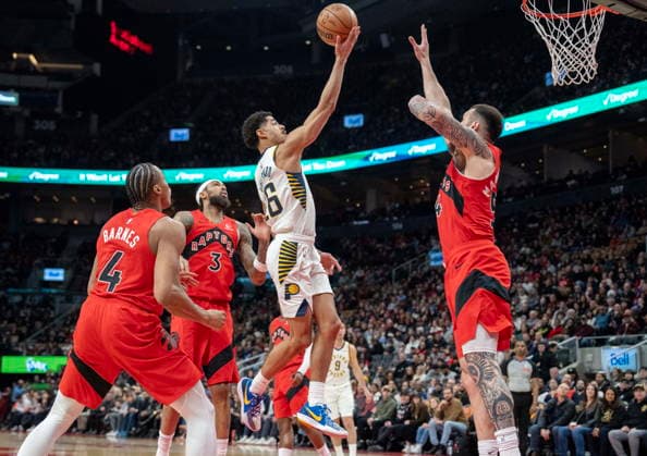 February 8, 2026, Toronto, On, Canada: Indiana Pacers guard Ben Sheppard (26) soars to the hoop past Toronto Raptors Brandon Ingram (3), Scottie Barnes (4) and Sandro Mamukelashvili (54) during first half NBA, Basketball Herren, USA action in Toronto on Sunday Feb. 8, 2026. Canada News - February 8, 2026  - ZUMAc35_ 20260208_zaf_c35_203 Copyright: xFrankxGunnx