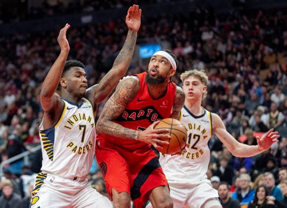 February 8, 2026, Toronto, On, Canada: Toronto Raptors forward Brandon Ingram (centre) works his way to the hoop past Indiana Pacers guard Kam Jones (7) and Johnny Furphy (12) during second half NBA, Basketball Herren, USA action in Toronto, Sunday, Feb. 8, 2026. Canada News - February 8, 2026  - ZUMAc35_ 20260208_zaf_c35_206 Copyright: xFrankxGunnx