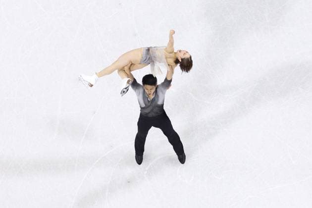 Milan Cortina Olympics: Figure skating, Eiskunstlauf Riku Miura (top) and Ryuichi Kihara of Japan pose at the conclusion of the pairs free program during the figure skating team event at the Milan Cortina Olympics at Milano Ice Skating Arena in Milan on Feb. 8, 2026.  A14AA0005258471P
