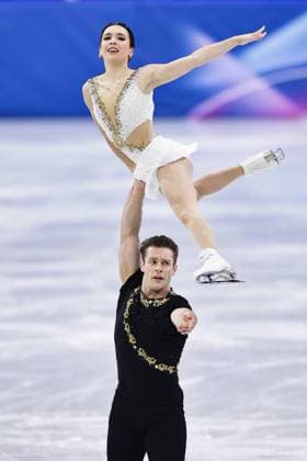Milan Cortina Olympics: Figure skating, Eiskunstlauf Lia Pereira (top) and Trennt Michaud of Canada perform in the pairs free program during the figure skating team event at the Milan Cortina Olympics at Milano Ice Skating Arena in Milan on Feb. 8, 2026.  A14AA0005258852P