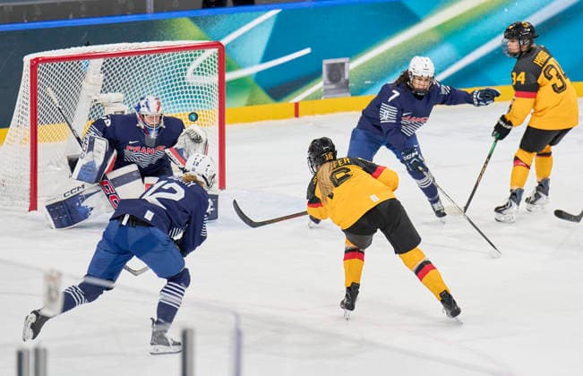 Jule Schiefer of Germany missed against Alice Philbert of France at the preliminary women Ice hockey, Eishockey match Group B Germany - France of the Milano Cortina 2026 Winter Olympic Games, Olympische Spiele, Olympia, OS at Milano Rho Ice Hockey Arena on February 9, 2026 in Milan, Italy.