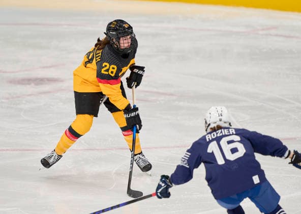 Katarina Jobst-Smith of Germany compete and fight for the puck against Clara Rozier of France at the preliminary women Ice hockey, Eishockey match Group B Germany - France of the Milano Cortina 2026 Winter Olympic Games, Olympische Spiele, Olympia, OS at Milano Rho Ice Hockey Arena on February 9, 2026 in Milan, Italy.