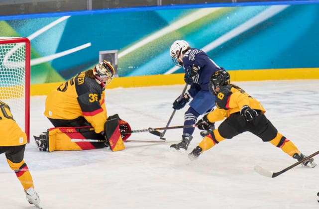 Sandra Abstreiter of Germany Anae Simon of France at the preliminary women Ice hockey, Eishockey match Group B Germany - France of the Milano Cortina 2026 Winter Olympic Games, Olympische Spiele, Olympia, OS at Milano Rho Ice Hockey Arena on February 9, 2026 in Milan, Italy.