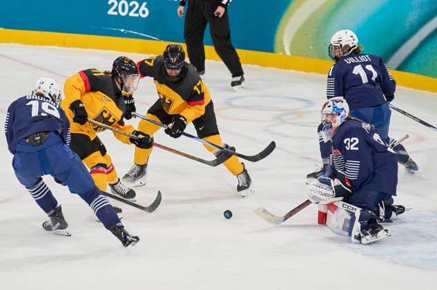 Nicola Hadraschek- Eisenschmid of Germany Emily Nix of Germany compete and fight for the puck against Alice Philbert of France at the preliminary women Ice hockey, Eishockey match Group B Germany - France of the Milano Cortina 2026 Winter Olympic Games, Olympische Spiele, Olympia, OS at Milano Rho Ice Hockey Arena on February 9, 2026 in Milan, Italy.