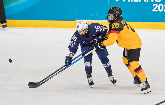 Katarina Jobst-Smith of Germany compete and fight for the puck against Clara Rozier of France at the preliminary women Ice hockey, Eishockey match Group B Germany - France of the Milano Cortina 2026 Winter Olympic Games, Olympische Spiele, Olympia, OS at Milano Rho Ice Hockey Arena on February 9, 2026 in Milan, Italy.