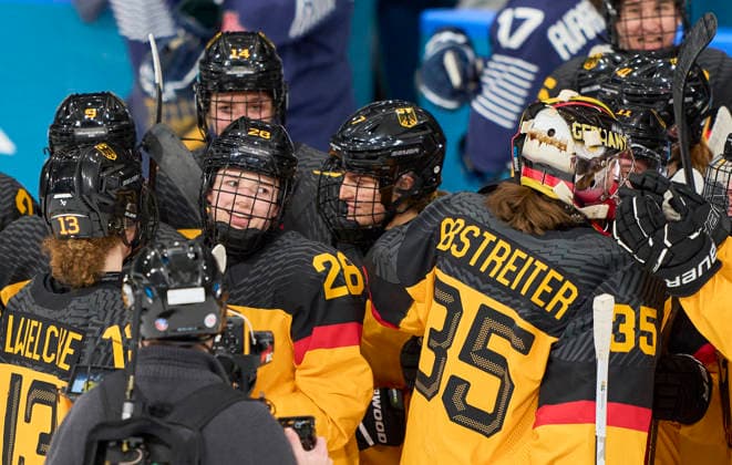 Katarina Jobst-Smith of Germany celebrates with Franziska Feldmeier of Germany Sandra Abstreiter of Germany after the preliminary women Ice hockey, Eishockey match Group B Germany - France of the Milano Cortina 2026 Winter Olympic Games, Olympische Spiele, Olympia, OS at Milano Rho Ice Hockey Arena on February 9, 2026 in Milan, Italy.