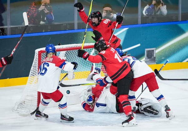 February 9, 2026, Milan, ITALY: Canadas Julia Gosling (88) and Brianne Jenner (19) celebrate Gosling s goal against Czech Republic goalie Michaela Hesova (1) as Katerina Mrazova (16) watches during the first period of a preliminary round women s hockey game at the Milan Cortina Winter Olympics, in Milan, on Monday, February 9, 2026. Canada News - February 9, 2026  - ZUMAc35_ 20260209_zaf_c35_159 Copyright: xDarrylxDyckx