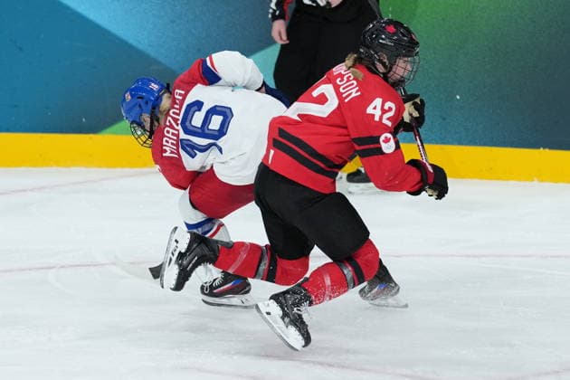 February 9, 2026, Milan, ITALY: CzechiaöÄÃ s Katerina Mrazova (16) checks CanadaöÄÃ s Claire Thompson (42) during the second period of a preliminary round women s hockey game at the Milan Cortina Winter Olympics, in Milan, on Monday, February 9, 2026. Canada News - February 9, 2026  - ZUMAc35_ 20260209_zaf_c35_180 Copyright: xDarrylxDyckx