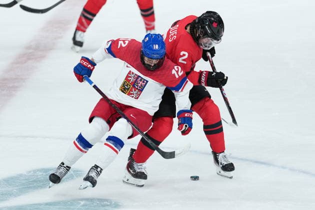 February 9, 2026, Milan, ITALY: CanadaöÄÃ s Sophie Jaques (2) and CzechiaöÄÃ s Klara Hymlarova (12) battle for the puck during the third period of a preliminary round women s hockey game at the Milan Cortina Winter Olympics, in Milan, on Monday, February 9, 2026. Canada News - February 9, 2026  - ZUMAc35_ 20260209_zaf_c35_223 Copyright: xDarrylxDyckx