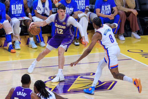 February 9, 2026, Los Angeles, California, USA: Jake LaRavia 12 of the Los Angeles Lakers receives the ball as Jalen Williams 8 of the Oklahoma City Thunder defends during their regular season NBA, Basketball Herren, USA game on Monday February 9, 2026 at Crypto.com Arena in Los Angeles, California. ARIANA RUIZ PI Los Angeles USA - ZUMAp124 20260209_zaa_p124_009 Copyright: xArianaxRuizx