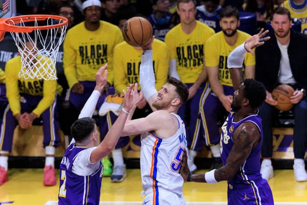 February 9, 2026, Los Angeles, California, USA: Isaiah Hartenstein 55 of the Oklahoma City Thunder makes a two point shot as Jake LaRavia 12 and Deandre Ayton 5 of the Los Angeles Lakers defend during their regular season NBA, Basketball Herren, USA game on Monday February 9, 2026 at Crypto.com Arena in Los Angeles, California. ARIANA RUIZ PI Lakers Vs. Thunder  - ZUMAp124 20260209_zaa_p124_002 Copyright: xArianaxRuizx