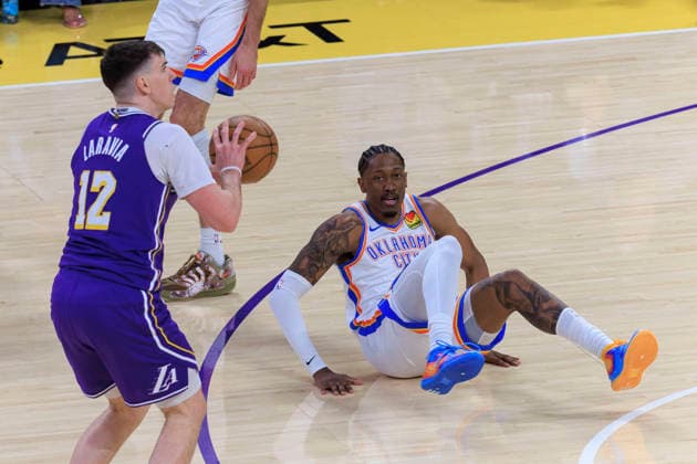 February 9, 2026, Los Angeles, California, USA: Jake LaRavia 12 of the Los Angeles Lakers takes possession the ball as Jalen Williams 8 of the Oklahoma City Thunder falls backwards during their regular season NBA, Basketball Herren, USA game on Monday February 9, 2026 at Crypto.com Arena in Los Angeles, California. ARIANA RUIZ PI Lakers Vs. Thunder  - ZUMAp124 20260209_zaa_p124_008 Copyright: xArianaxRuizx