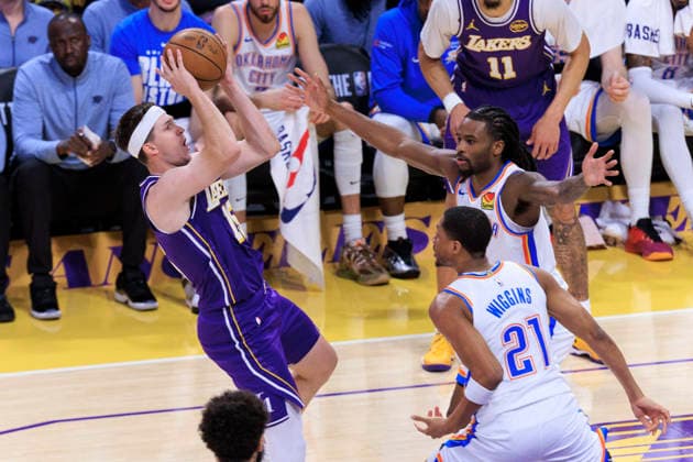 February 9, 2026, Los Angeles, California, USA: Austin Reaves 15 of the Los Angeles Lakers makes a fadeaway shot as Cason Wallace 22 and Aaron Wiggins 21 of the Oklahoma City Thunder defend during their regular season NBA, Basketball Herren, USA game on Monday February 9, 2026 at Crypto.com Arena in Los Angeles, California. Lakers lose to Thunder, 110-119. ARIANA RUIZ PI Lakers Vs. Thunder  - ZUMAp124 20260209_zaa_p124_021 Copyright: xArianaxRuizx