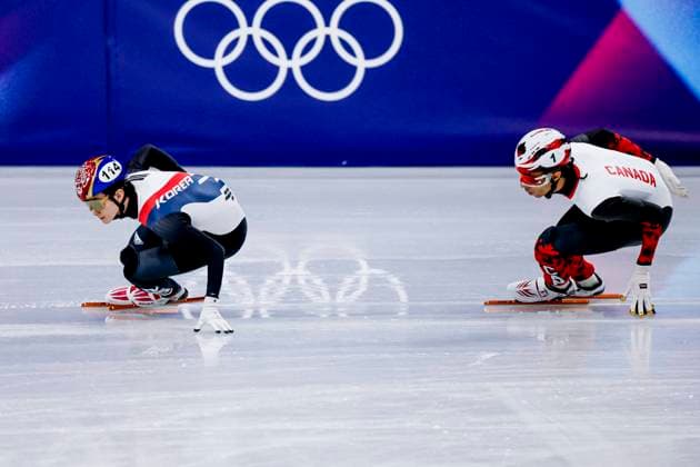 Dong Min Shin of Republic of Korea and William Dandjinou of Canada Men s 1000m, Milano Cortina 2026 Winter Olympics: Day 4, Short Track Speed skating, Eisschnelllauf - Milano Cortina 2026 Winter Olympics: Day 4, Milano Speed Skating Stadium, February 10, 2026, Milan, Italy.