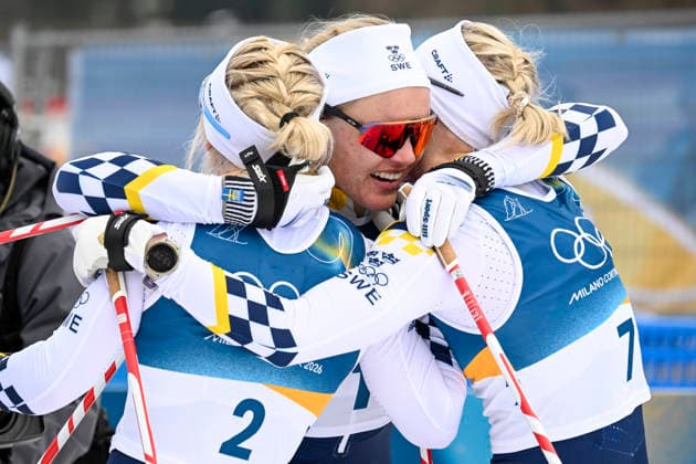 LKS 20260210 Sweden s skiers Jonna Sundling (2), winner Linn Svahn and Maja Dahlqvist (7) hug after the women s Sprint Classic Final at the Milano Cortina Winter Olympics at the Tesero Cross Country Skiing Stadium on February 10, 2026. Swedes took the first three spots. - MARKKU ULANDER Tesero Italy P2tIFpxjb_Q  Copyright: xMarkkuxUlanderx P2tIFpxjb_Q