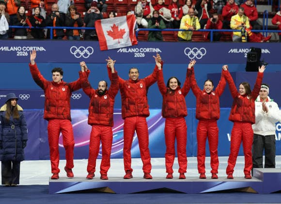 February 10, 2026, Milan, Lombardy, Italy: FELIX ROUSSEL, STEVEN DUBOIS, WILLIAM DANDJINOU, COURTNEY SARAULT, FLORENCE BRUNELLE and KIM BOUTIN of Team Canada celebrate winning the silver medal in the Mixed Team Relay final of the Short Track Speed skating, Eisschnelllauf at the Milano Cortina 2026 Winter Olympic Games, Olympische Spiele, Olympia, OS Olympics 2026: Milano Cortina: Short Track Speed Skating  - ZUMAc179 20260210_oly_c179_044 Copyright: xMickaelxChavetx
