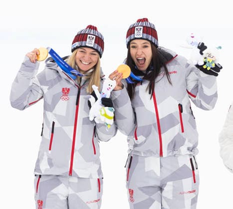 February 10, 2026, Cortina D ampezzo, Lombardy, Italy: Ariane Raedler, left, and teammate Katharina Huber of team Austria 2 celebrate their gold medal in the Womens Team Combined at Tofane Alpine Skiing Centre for the Milano Cortina 2026 Winter Olympics. Cortina D ampezzo Italy - ZUMAsc5_ 20260210_oly_sc5_015 Copyright: xErichxSchlegelx