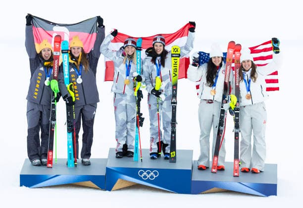 February 10, 2026, Cortina D ampezzo, Lombardy, Italy: Ariane Raedler and teammate Katharina Huber of team Austria 2, center, celebrate their gold medal in the Womens Team Combined at Tofane Alpine Skiing Centre for the Milano Cortina 2026 Winter Olympics. Kira Weidle-Winkelmann and Emma Aicher of team Germany 2, left, won sliver, and Jaqueline Wiles and Paula Moltzan of team USA 2 on bronze. Olympics 2026: Milano Cortina: Alpine Skiing: Women S  - ZUMAsc5_ 20260210_oly_sc5_026 Copyright: xErichxSchlegelx